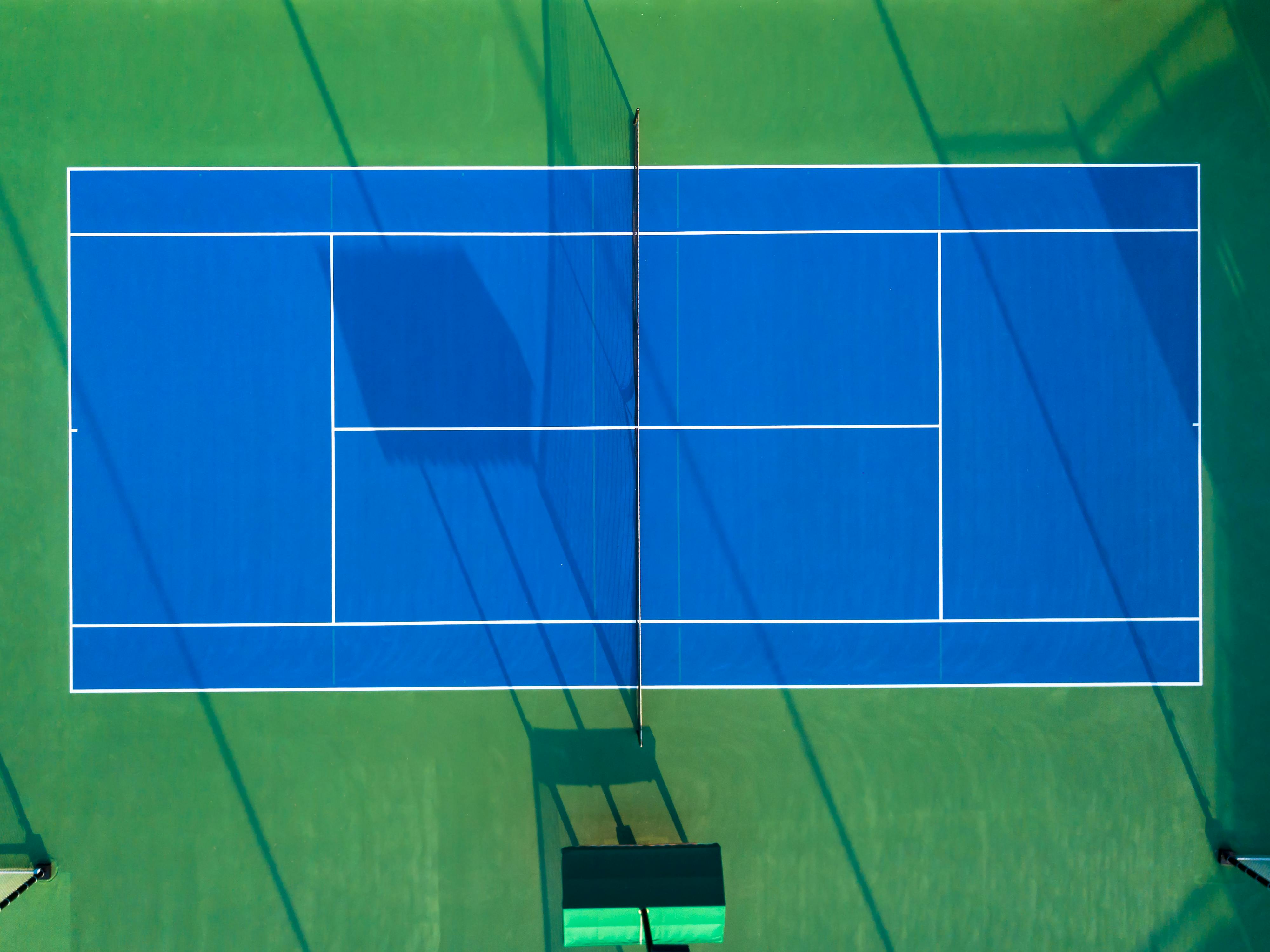 Professional tennis court surfacing by Xio Construction