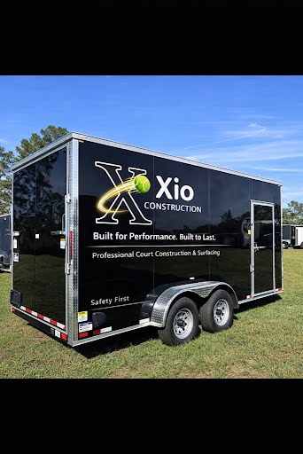 Xio Construction branded trailer — Professional Court Construction and Surfacing